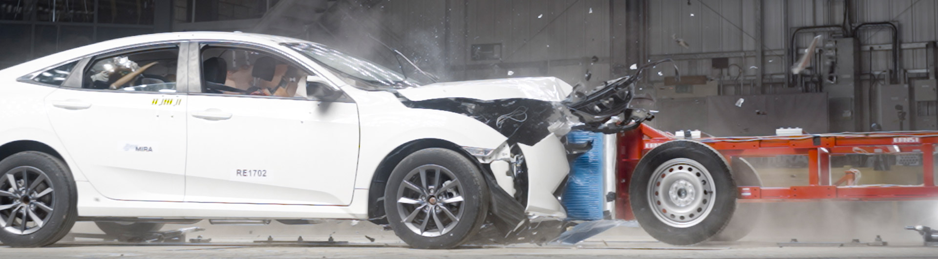 A white car crashing in a test lab at HORIBA MIRA